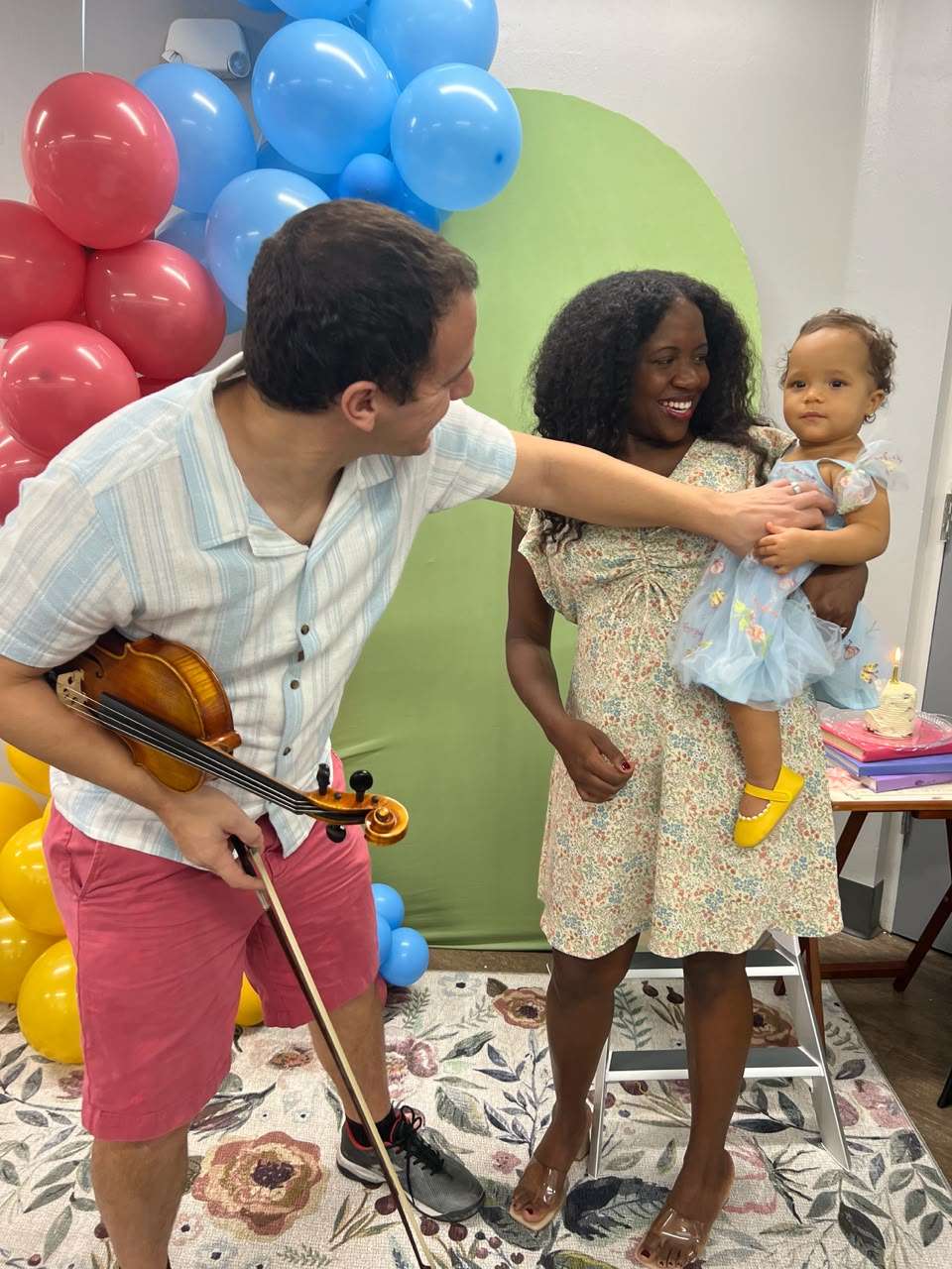 Michael Sanchez teaching violin to students